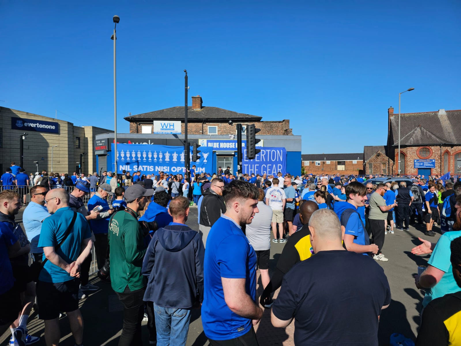 Everton crest fans in the Hill Dickinson Stadium fan plaza