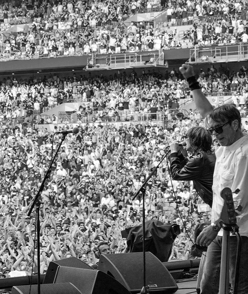 Damon Minchella and Richard Ashcroft on stage